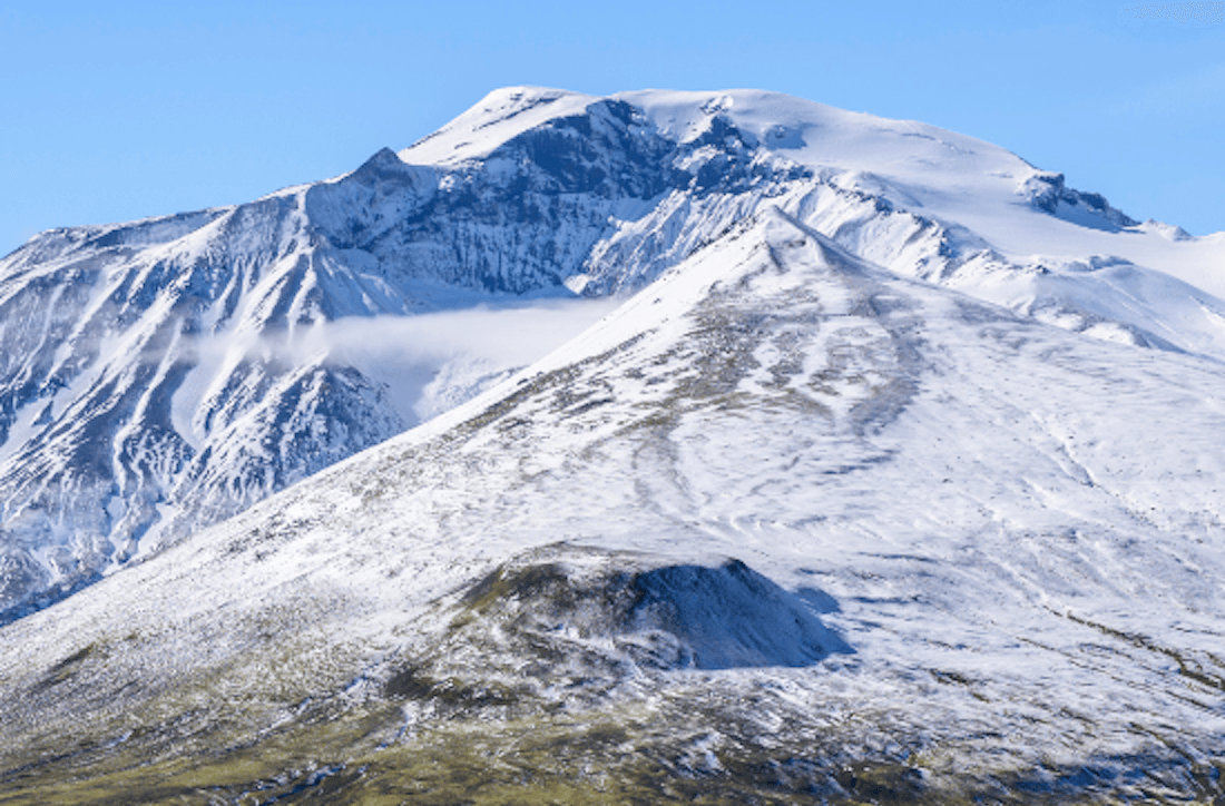 Snow-streaked slopes on Snæfell above the marked hiking area in Vatnajökull National Park.