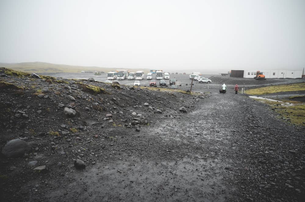 Gravel walking approach and parking area near Sólheimajökull Glacier in wet weather