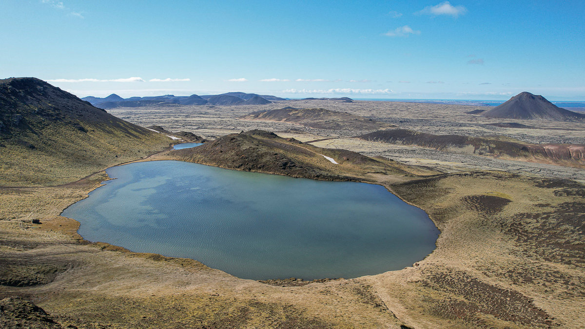 Spákonuvatn below Reykjanes hills with Keilir rising beyond the lava fields.
