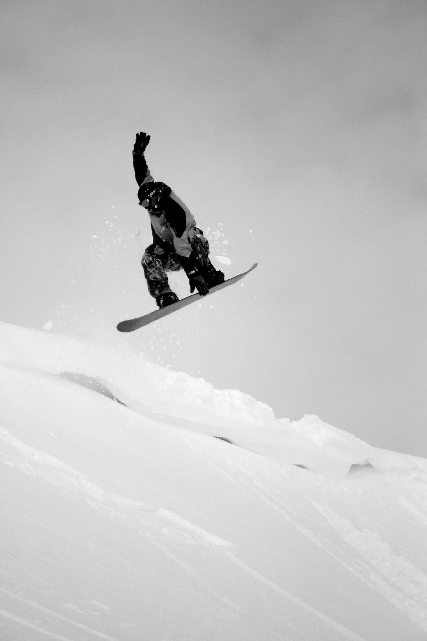 Snowboarder jumping at Stafdalur Ski Station in East Iceland.