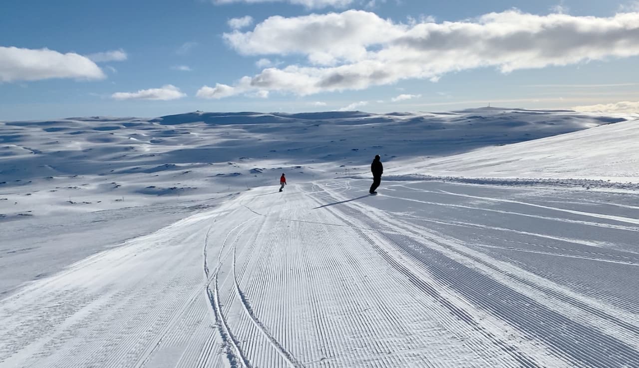 Cross-country ski tracks across the snowy Stafdalur ski area on Fjarðarheiði.