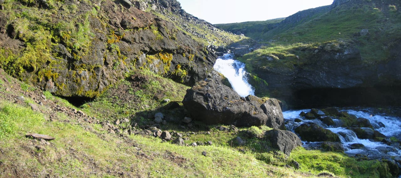 Rocky stream and old lignite mine area in Syðridalur valley near Bolungarvík.