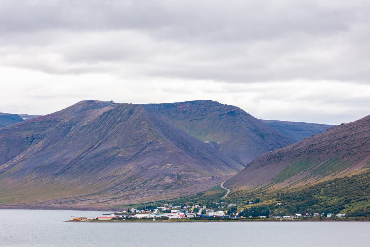 Þingeyri village below Sandafell and Westfjords mountains beside Dýrafjörður.