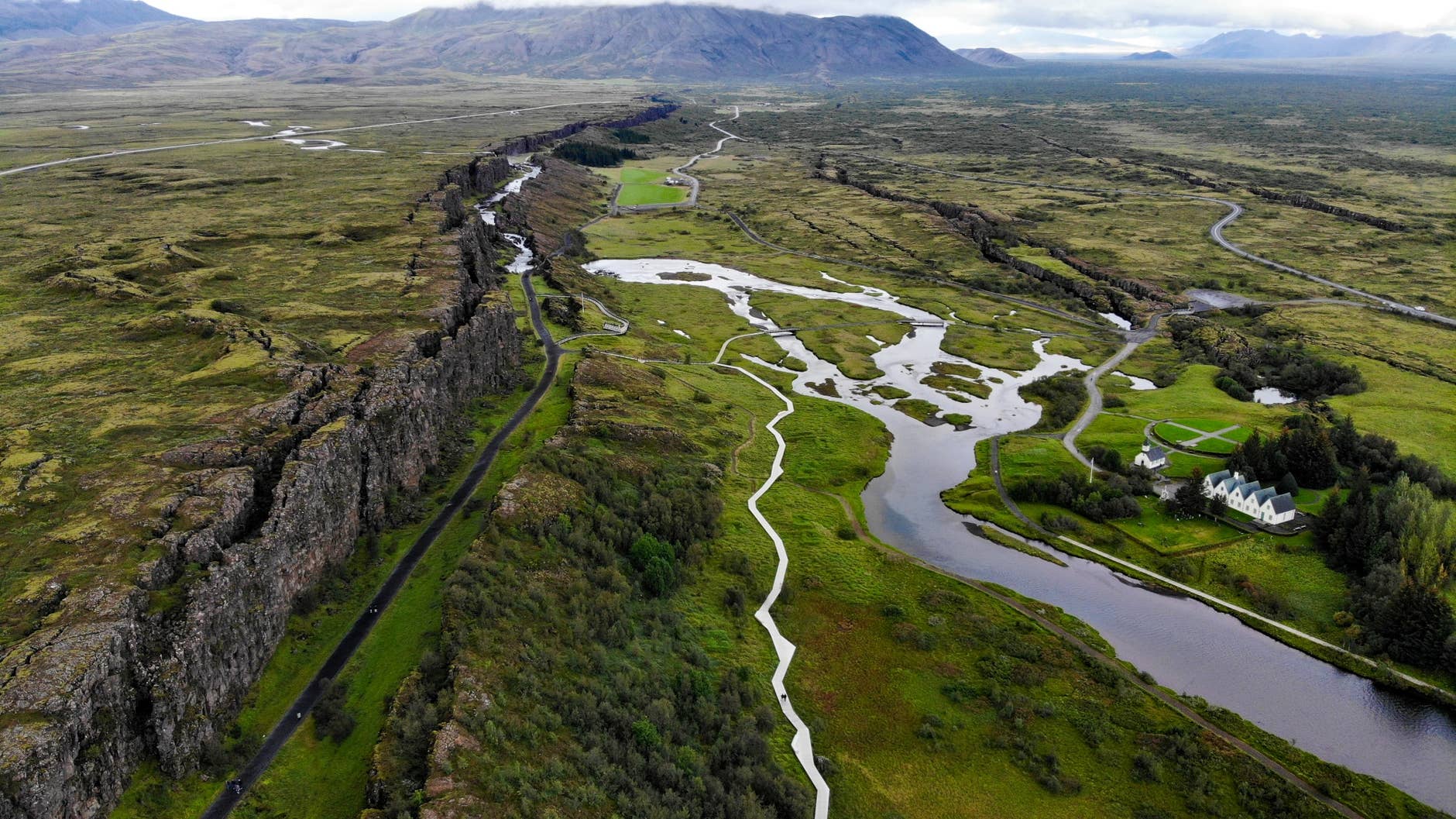 Aerial view of Almannagjá, the Öxará river, and Lake Þingvallavatn at Þingvellir National Park.