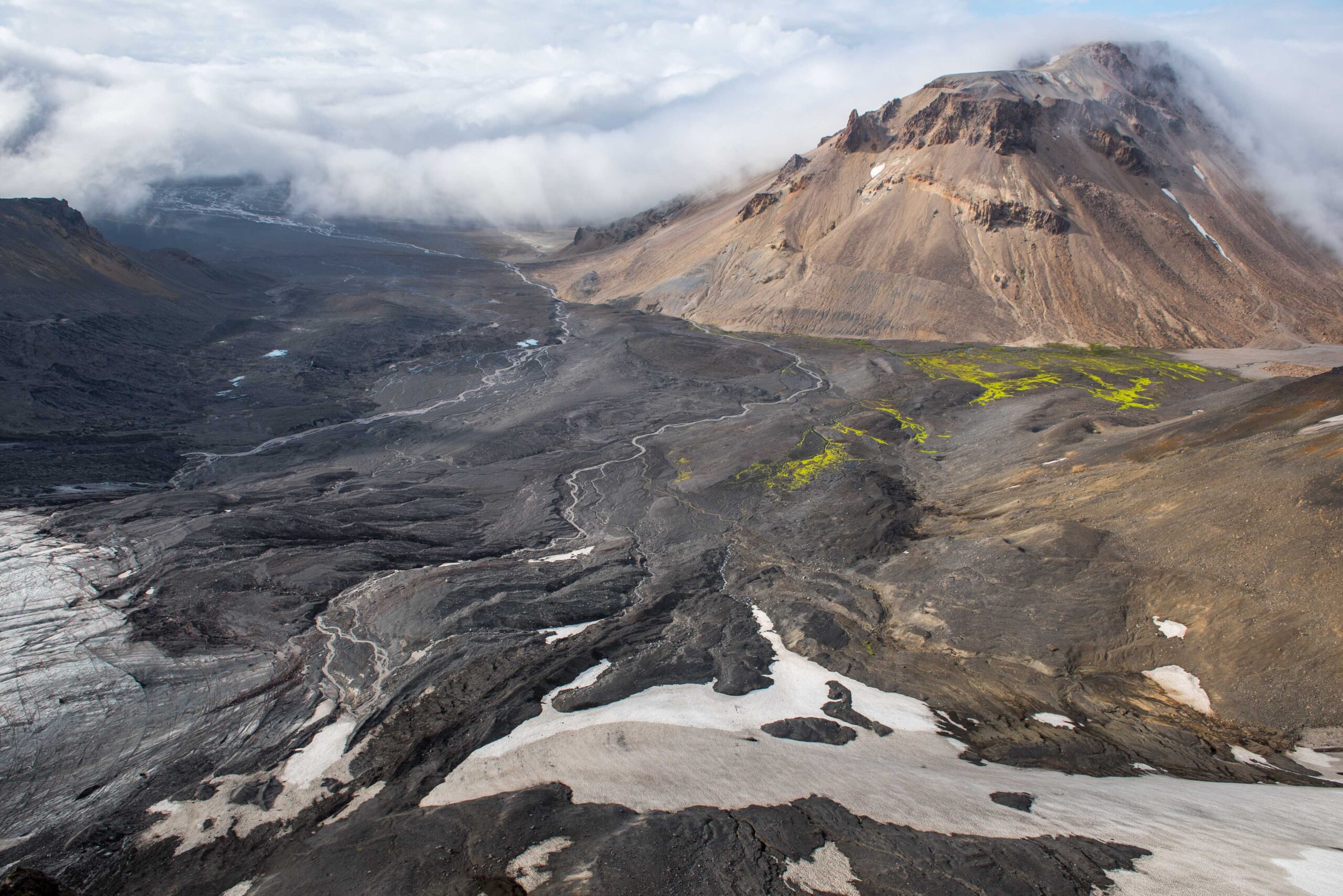 Outlet ice and dark volcanic slopes on Þórisjökull in the western Highlands.