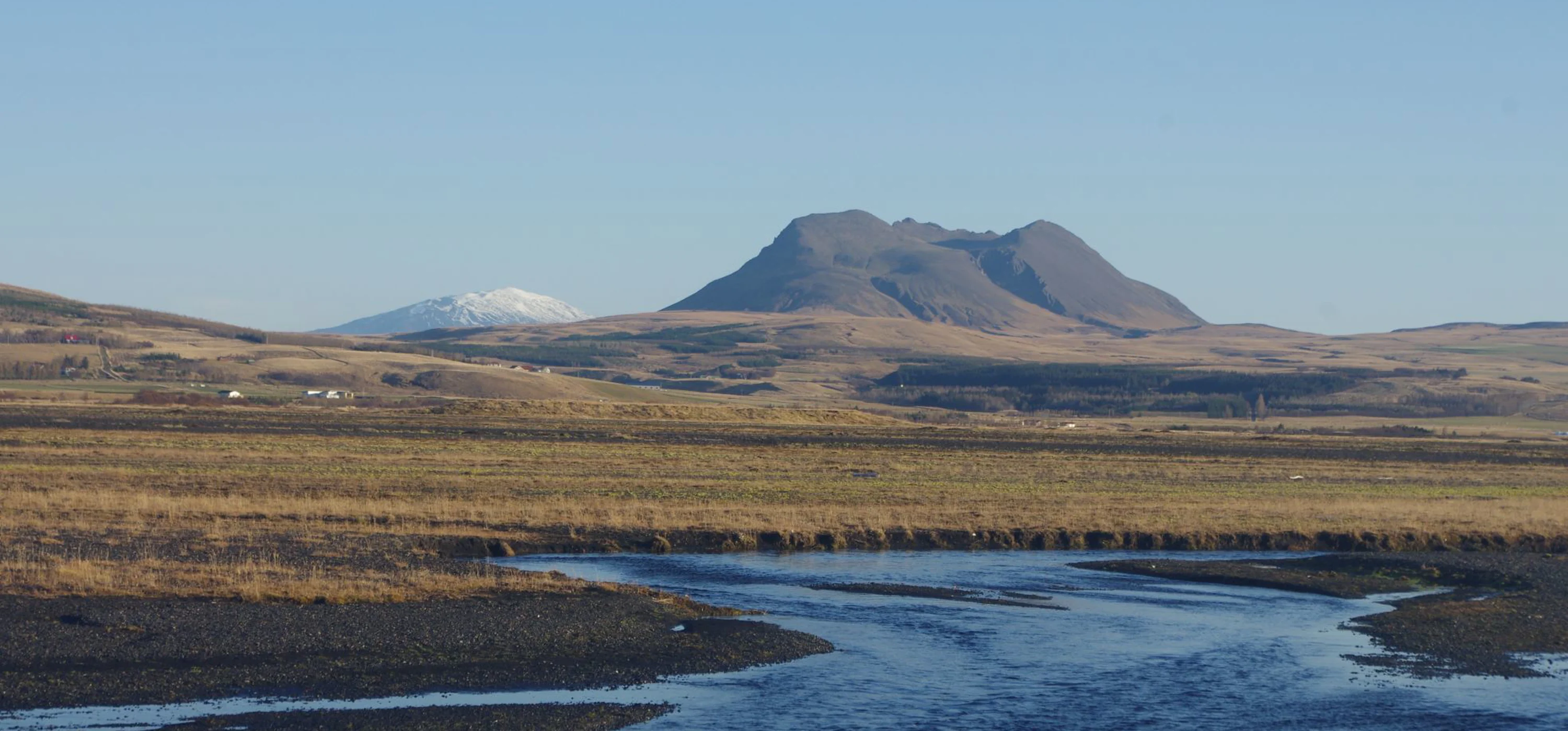 Þríhyrningur mountain rising above the Fljótshlíð countryside in South Iceland.