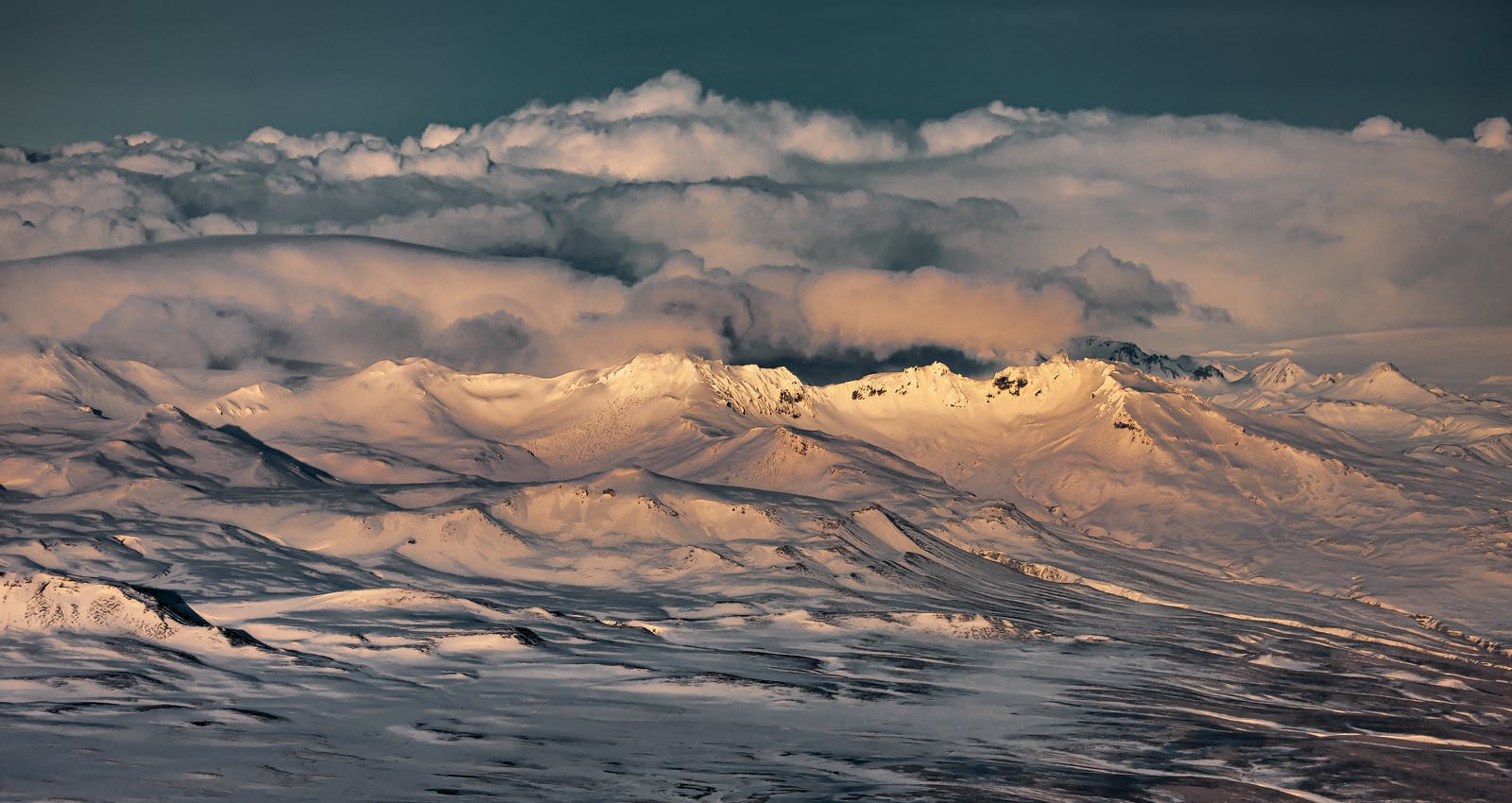 Snow-covered Tindfjöll ridges below cloud in the South Iceland highlands.