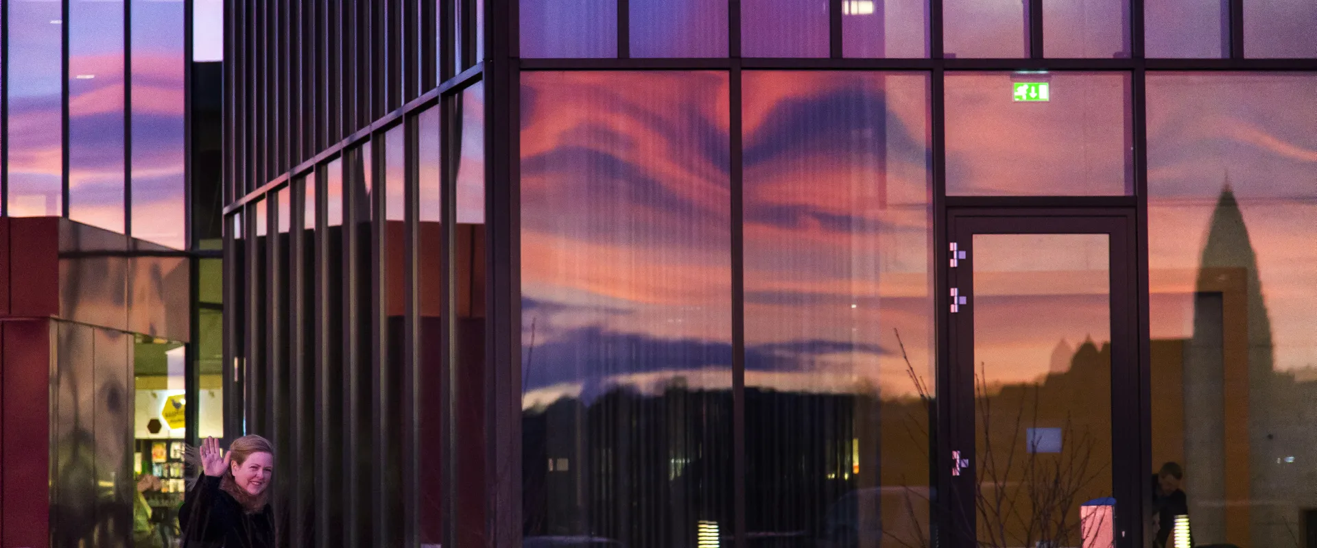 University Centre glass facade reflecting evening light on the University of Iceland campus