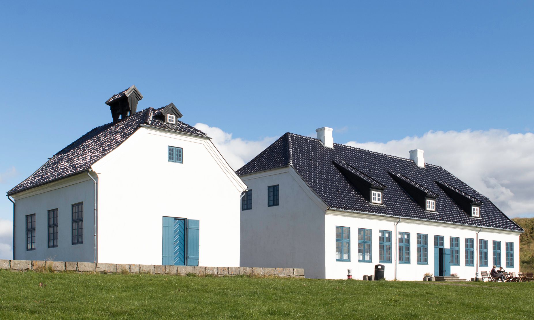 Viðey House and Viðey Church standing on a grassy part of the island